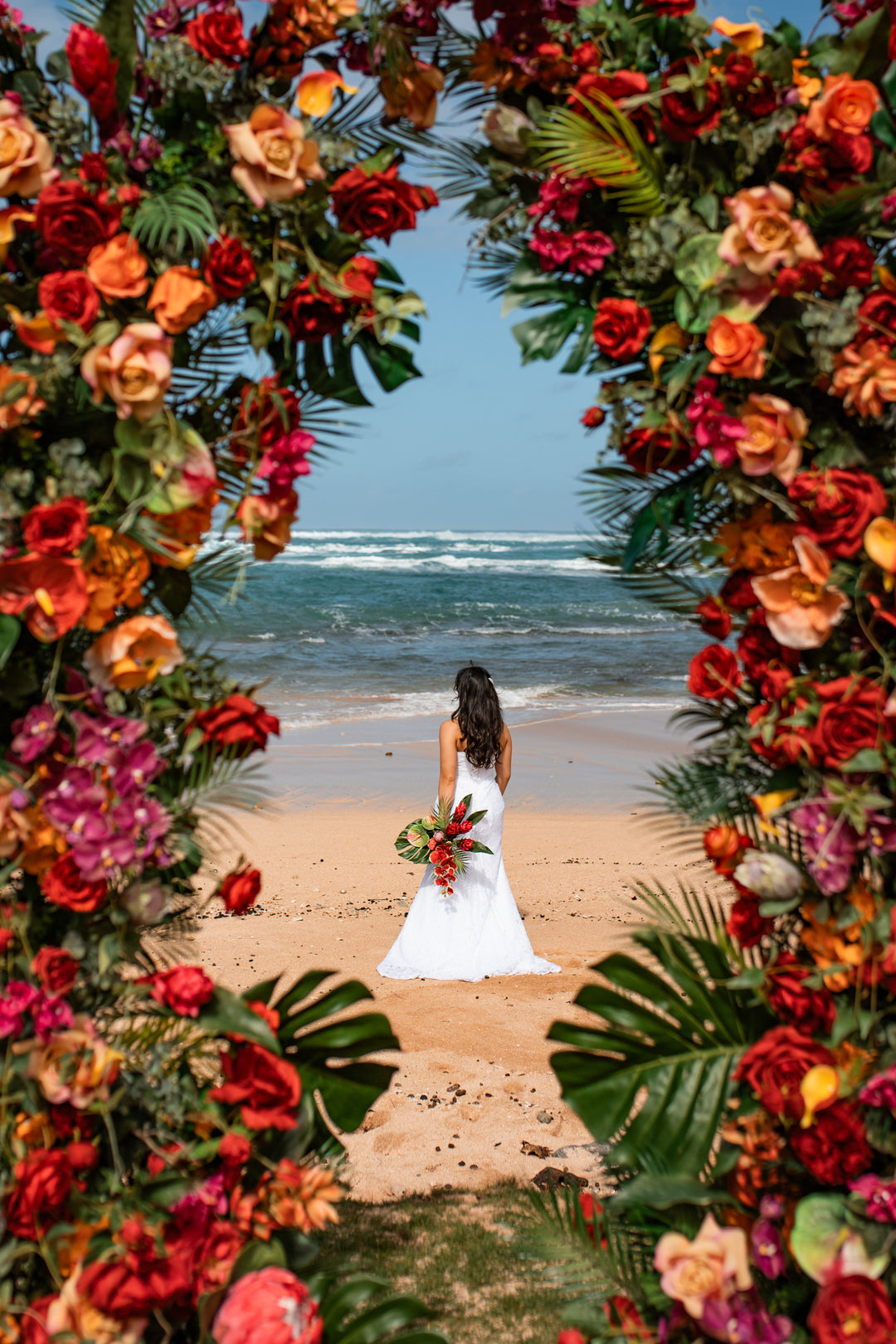 Aloha Tropical Floral Pillars;  Vibrant tropical wedding floral pillars for luxury Oahu elopement